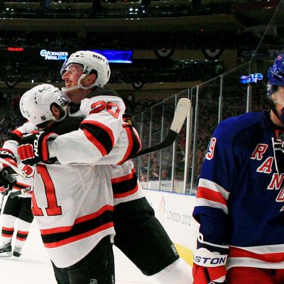 NEW YORK, NY - MAY 23: Ryan Carter #20 of the New Jersey Devils celebrates his third period goal with Stephen Gionta #11 as Brad Richards #19 of the New York Rangers reacts in Game Five of the Eastern Conference Final during the 2012 NHL Stanley Cup Playoffs at Madison Square Garden on May 23, 2012 in New York City. (Photo by Bruce Bennett/Getty Images)