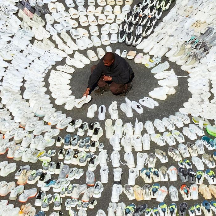 Kanye West Poses With All His Yeezy Shoes