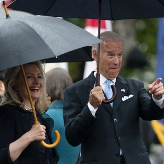 US Vice President Joe Biden points to the crowd alongside Secretary of State Hillary Clinton as US President Barack Obama welcomes South Korean President Lee Myung-bak during a State Arrival Ceremony on the South Lawn of the White House in Washington, DC, on October 13, 2011. Obama hosts his South Korean counterpart for a full day of official State ceremonies, including a State Dinner. AFP PHOTO / Saul LOEB (Photo credit should read SAUL LOEB/AFP/Getty Images)