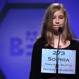Sophia Limacher of Seattle, Washington, reacts after she misspelled her word in the round five of the 2013 Scripps National Spelling Bee May 30, 2013 at Gaylord National Resort and Convention Center in National Harbor, Maryland. Forty-two have advanced to the semifinal of the annual spelling contest for the championship.