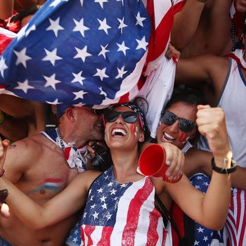 U.S. supporters celebrate after their loss to Germany after watching the match at FIFA Fan Fest on June 26, 2014 in Rio de Janeiro, Brazil. The U.S. lost 1-0 but still advance to the knockout stage of the 2014 FIFA World Cup based on goal differential. 
