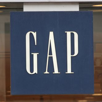 CHICAGO, IL - OCTOBER 13: A sign hangs above the entrance of a GAP store on October 13, 2011 in Chicago, Illinois. Gap Inc. plans to reduce the number of Gap brand stores to 700 in North America, closing roughly one-third of their existing stores by the end of 2013. 