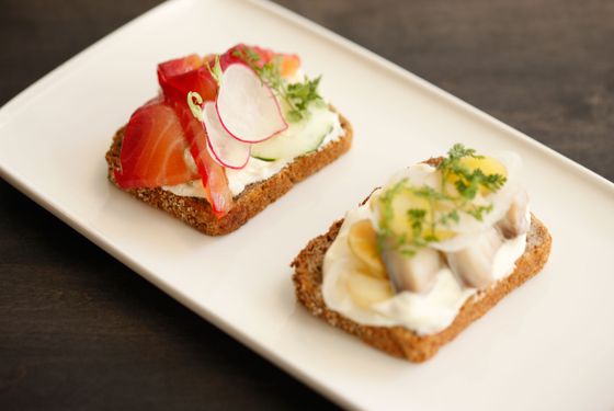 Rye bread tartines with beet-cured salmon and pickled mackarel.