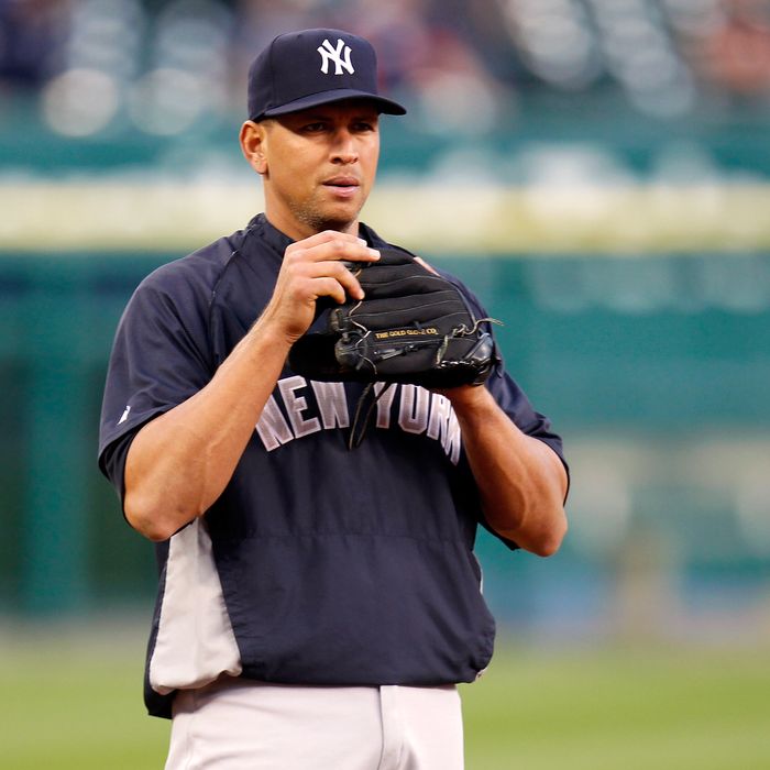 Alex Rodriguez #13 of the New York Yankees looks on as he warms up against the Detroit Tigers during game four of the American League Championship Series at Comerica Park on October 17, 2012 in Detroit, Michigan.