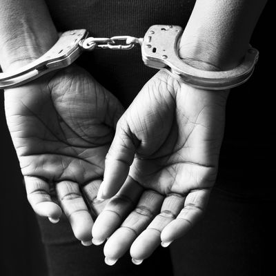 Handcuffed woman.