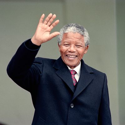 South African anti-apartheid leader and African National Congress (ANC) member Nelson Mandela waves to the press as he arrives at the Elysee Palace, 07 June 1990, in Paris, to have talks with French president Francois Mitterrand. Nelson Mandela, who was released from jail on 11 February 1990, is in Paris for a two-day official visit. 