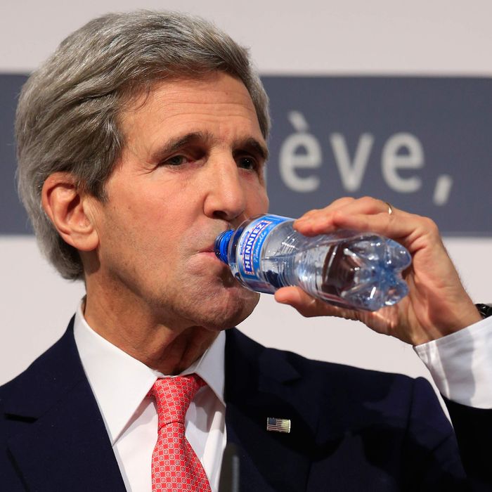 US Secretary of State John Kerry drinks water as he answers to questions during a press conference at the CICG (Centre International de Conferences Geneve) after talks over Iran's nuclear programme in Geneva on November 24, 2013. World powers on November 24 agreed a landmark deal with Iran halting parts of its nuclear programme in what US President Barack Obama called 