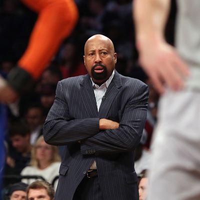 Mike Woodson of the New York Knicks handles bench duties during the game against the Brooklyn Nets at the Barclays Center on April 15, 2014 in the Brooklyn borough of New York City. 