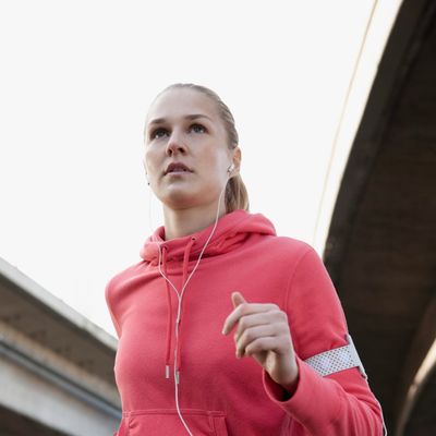 Young woman taking run --- Image by ? Dirk Lindner/Corbis