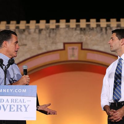 DAYTONA BEACH, FL - OCTOBER 19: Republican presidential candidate Mitt Romney (L) speaks as Republican vice presidential candidate, U.S. Rep Paul Ryan (R-WI) looks on during a Victory Rally at the Daytona Beach Bandshell on October 19, 2012 in Daytona Beach, Florida. Romney is in Florida over the weekend to prepare for the third and final debate with U.S. President Barack Obama. (Photo by Justin Sullivan/Getty Images)