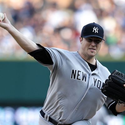 Phil Hughes #65 of the New York Yankees pitches in the first inning of the game against the Detroit Tigers at Comerica Park on August 7, 2012 in Detroit, Michigan. 