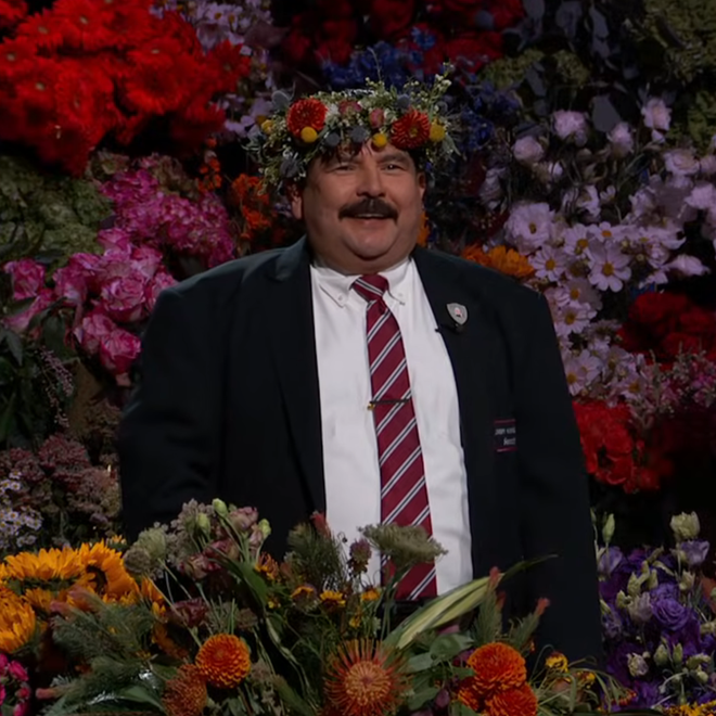 Guillermo Rodriguez wearing a flower ‍crown after Diego Luna bought out the flower market.