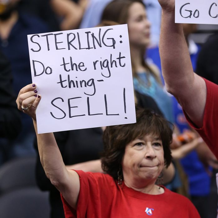 LOS ANGELES, CA - APRIL 29: Los Angeles Clippers hold up signs referencing the Donald Sterling situation before the game with the Golden State Warriors in Game Five of the Western Conference Quarterfinals during the 2014 NBA Playoffs at Staples Center on April 29, 2014 in Los Angeles, California. NOTE TO USER: User expressly acknowledges and agrees that, by downloading and or using this photograph, User is consenting to the terms and conditions of the Getty Images License Agreement. (Photo by Stephen Dunn/Getty Images)