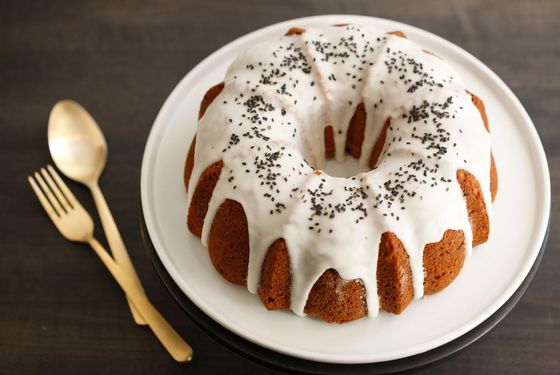 Black sesame, apple, and ricotta bundt cake with lemon glaze.