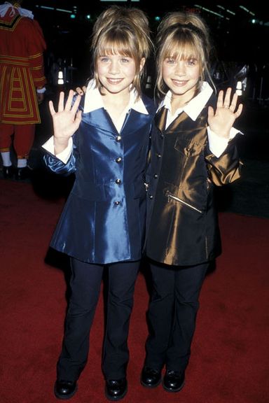 By 1998, the Olsen twins had their own successful production company, so it’s only natural that they looked and dressed like tiny talk-show hosts.