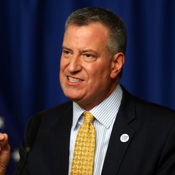 New York Mayor Bill de Blasio answers questions during a press conference before Opening Day on March 31, 2014 at Citi Field in the Flushing neighborhood of the Queens borough of New York City. 