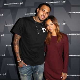 WEST HOLLYWOOD, CA - NOVEMBER 05: Recording artist Chris Brown (L) and model Karrueche Tran attend the Alexander Wang x H&M Pre-Shop Party at H&M on November 5, 2014 in West Hollywood, California. (Photo by Imeh Akpanudosen/Getty Images for H&M)