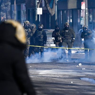 Federal agents block off the scene of a shooting as crowds gather on January 24, 2026 in Minneapolis, Minnesota