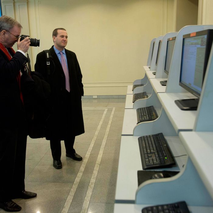 Executive Chairman of Google, Eric Schmidt, takes photographs as he tours a computer lab at Kim Il Sung University in Pyongyang, North Korea on Tuesday, Jan. 8, 2013. Schmidt is the highest-profile U.S. executive to visit North Korea - a country with notoriously restrictive online policies-since young leader Kim Jong Un took power a year ago. 