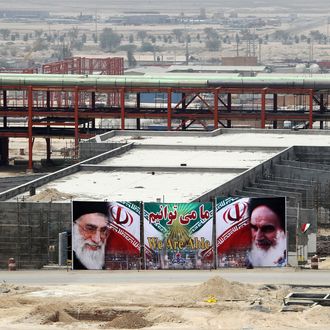 A huge banner bearing portraits of Iran