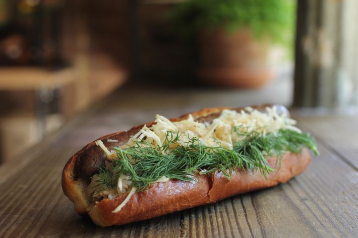 Pastrami-scrap hot dog with shiitake-mushroom sauce, fermented parsnips, and pickled onions.