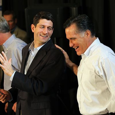 MILWAUKEE, WI - APRIL 01: Republican Presidential candidate, former Massachusetts Gov. Mitt Romney (R) jokes with U.S. Rep Paul Ryan (C) (R-WI) during a pancake brunch at Bluemound Gardens on April 1, 2012 in Milwaukee, Wisconsin. With less than a week before the Wisconsin primary, Mitt Romney continues to campaign through the state. (Photo by Justin Sullivan/Getty Images)