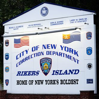 A sign of Rikers Island, where IMF head