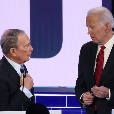 Democratic presidential candidates former New York City mayor Mike Bloomberg (L) and former Vice President Joe Biden speak during a break during the Democratic presidential primary debate at Paris Las Vegas on February 19, 2020 in Las Vegas, Nevada.