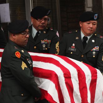 NEW YORK, NY - OCTOBER 13: Soldiers carry the casket of Army Pvt. Danny Chen in Chinatown on October 13, 2011 in New York City. Pvt. Chen who had been in Afghanistan for two months, was found dead with a gunshot wound below his chin on Oct. 3. While preliminary signs suggest Pvt.. Chen killed himself, the U.S. Army has told the soldiers parents that he was subjected to taunting and violence by some of the soldiers with whom he served with. (Photo by Spencer Platt/Getty Images)