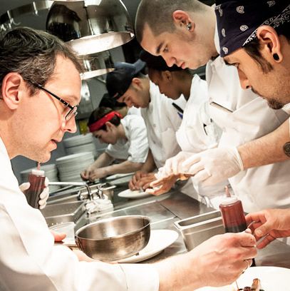 Chef Telepan finishes off his dish on the line.