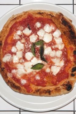 Tomato sauce, housemade mozzarella, and fresh basil; flash-fried and oven-finished