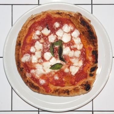 Tomato sauce, housemade mozzarella, and fresh basil; flash-fried and oven-finished