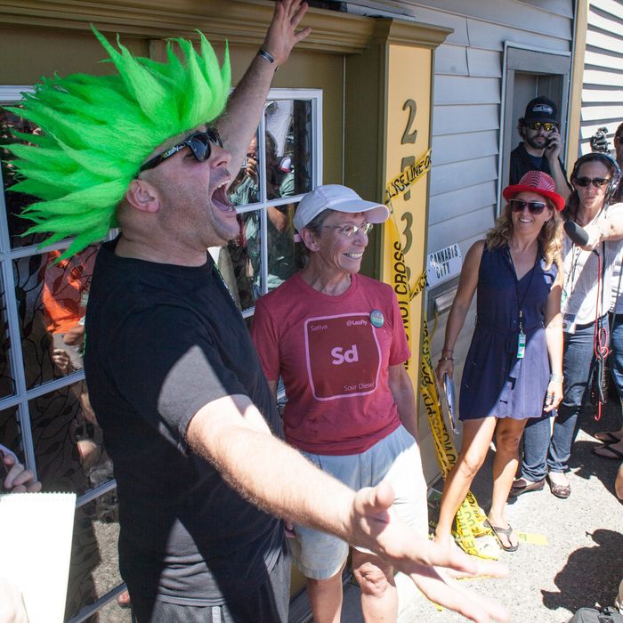Jeremy Cooper (L) waits with Deb Greene (R), who was first in line to enter Cannabis City, a retail marijuana store, on July 8, 2014 in Seattle, Washington. Cannabis City was the first retail marijuana store to open in Seattle on July 8 and one of many now operating in Washington state, nearly a year and a half after the state's voters chose to legalize marijuana.
