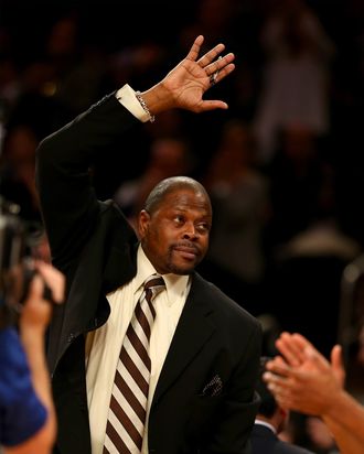 New York Knicks legend Patrick Ewing salutes the fans in the first quarter at Madison Square Garden on November 5, 2013 in New York City.Ewing is now an assistant coach on the Charlotte Bobcats.