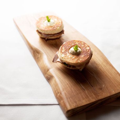Pork Belly Brioche: Two steamed brioche buns, confit pork belly, whole grain mustard, and fresh mint.