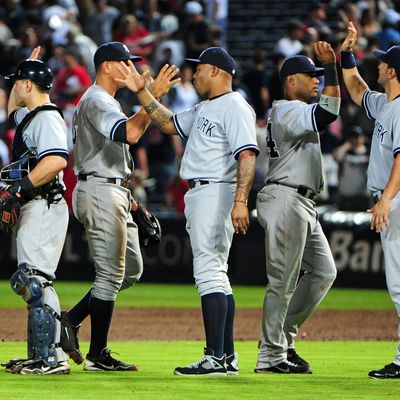 Members of the New York Yankees celebrate after the game against the Atlanta Braves at Turner Field on June 13, 2012 in Atlanta, Georgia. 