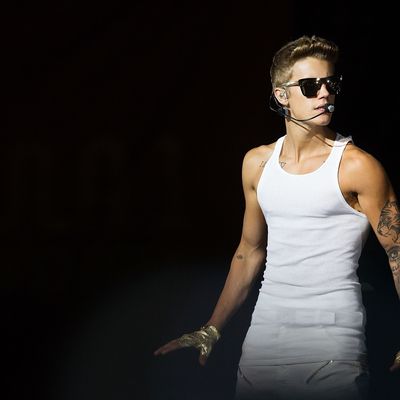 SINGAPORE - SEPTEMBER 23: Justin Bieber performs live at the Padang Stage on Day 3 at the closing party of the Singapore Formula One Grand Prix on September 23, 2013 in Singapore. (Photo by Nicky Loh/Getty Images)