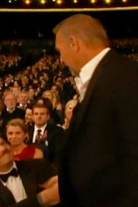 Here's the thing about real men: They don't wear ties, and they don't hug broads. They shake hands with co-stars and make Olympic jokes that only other real men get, so just know that somewhere out there, Jesse Ventura and Richard Grieco thought Kevin Costner's closing joke about his statue killed.