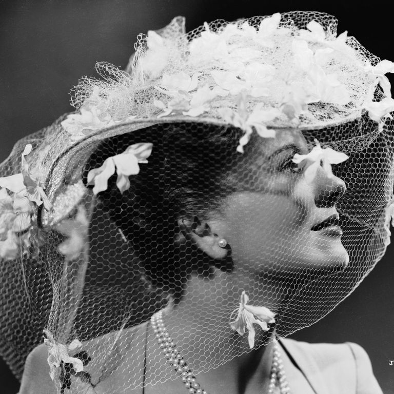 1941: British-born actress Joan Fontaine wearing an extravagant hat decorat...