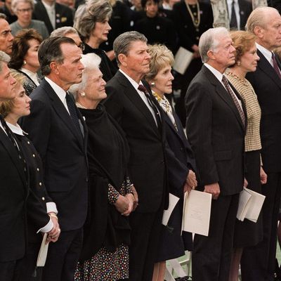 US President Bill Clinton (L) and First Lady Hillary Clinton (2ndL) are joined by four former presidents and their wives, 27 April 1994, during former President Richard Nixon's funeral in Yorba Linda, California. (L-R) President George Bush and Barbara Bush, President Ronald Reagan and Nancy Reagan, President Jimmy Carter and Rosalynn Carter, President Jerry Ford and Betty Ford. (Photo credit should read LUKE FRAZZA/AFP/Getty Images)