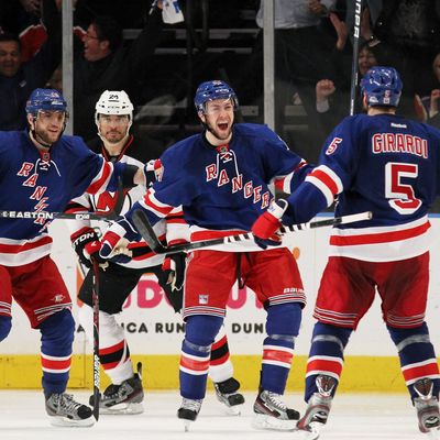 NEW YORK, NY - MAY 14: Dan Girardi #5 of the New York Rangers celebrates ihs third period goal with teammates Derek Stepan #21 and Marian Gaborik #10 of the New York Rangers in Game One of the Eastern Conference Finals during the 2012 NHL Stanley Cup Playoffs at Madison Square Garden on May 14, 2012 in New York City. (Photo by Bruce Bennett/Getty Images)