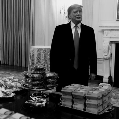 President Trump in behind a pile of fast food.