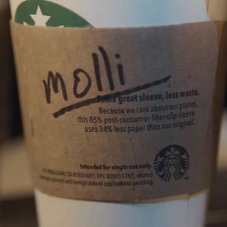 The Messed-Up Reason Starbucks Baristas Are Putting Stickers On Your Cups