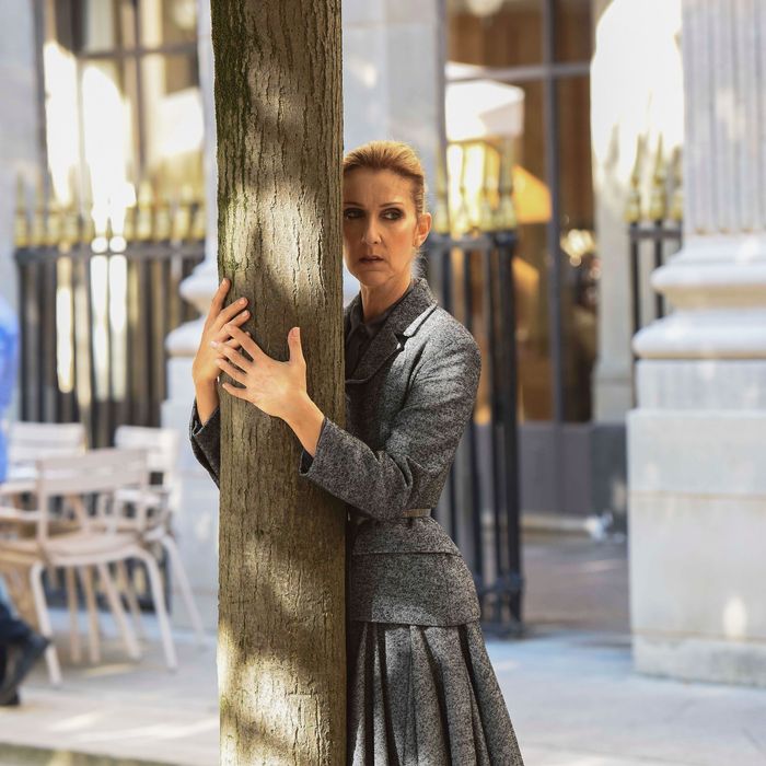 Céline Dion Hugs Tree During Photo Shoot In Paris