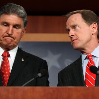 WASHINGTON, DC - APRIL 10: Sen. Pat Toomey (R-PA) (R) and Sen. Joe Manchin (D-WV) speak to the press about background checks for gun purchases, in the U.S. Capitol building April 10, 2013 in Washington DC. The pair is proposing a bipartisan compromise, a proposal to be voted on as an amendment that would expand background checks to firearms sales at gun shows and on the Internet. (Photo by Allison Shelley/Getty Images)