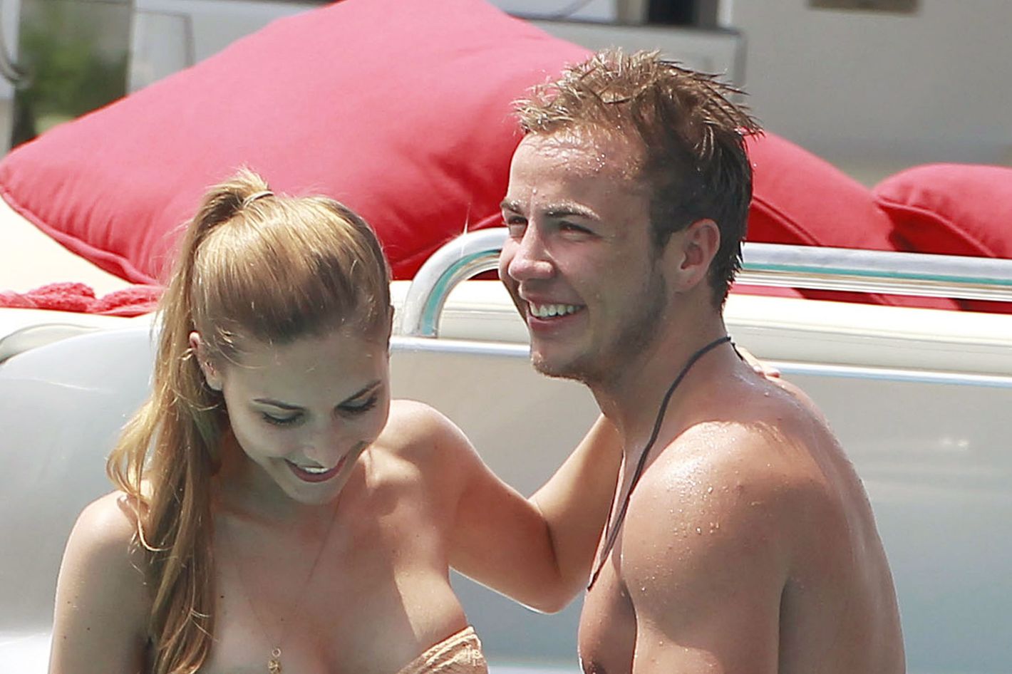 Mario Gotze's model wife helps him get over World Cup heartbreak as she  strips down to tiny bikini on the beach