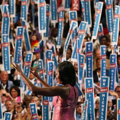 CHARLOTTE, NC - SEPTEMBER 04: First lady Michelle Obama exits the stage after speaking during day one of the Democratic National Convention at Time Warner Cable Arena on September 4, 2012 in Charlotte, North Carolina. The DNC that will run through September 7, will nominate U.S. President Barack Obama as the Democratic presidential candidate. (Photo by Justin Sullivan/Getty Images)