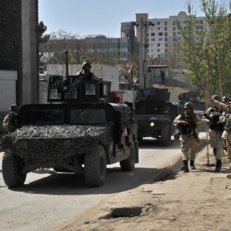 Afghan security forces arrive at the scene of an attack in Kabul on April 15, 2012. Explosions and gunfire rocked the Afghan capital Kabul on April 15, as suicide bombers struck across Afghanistan in coordinated attacks claimed by Taliban insurgents as the start of a spring offensive. AFP PHOTO/Massoud HOSSAINI (Photo credit should read MASSOUD HOSSAINI/AFP/Getty Images)