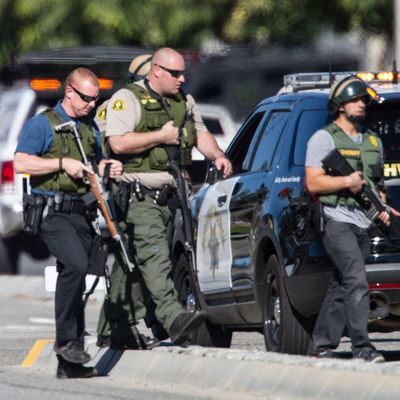 Police offices in SWAT gear secure the scene where a mass shooting occurred at the Inland Regional Center on December 2, 2105 in San Bernardino, California. 