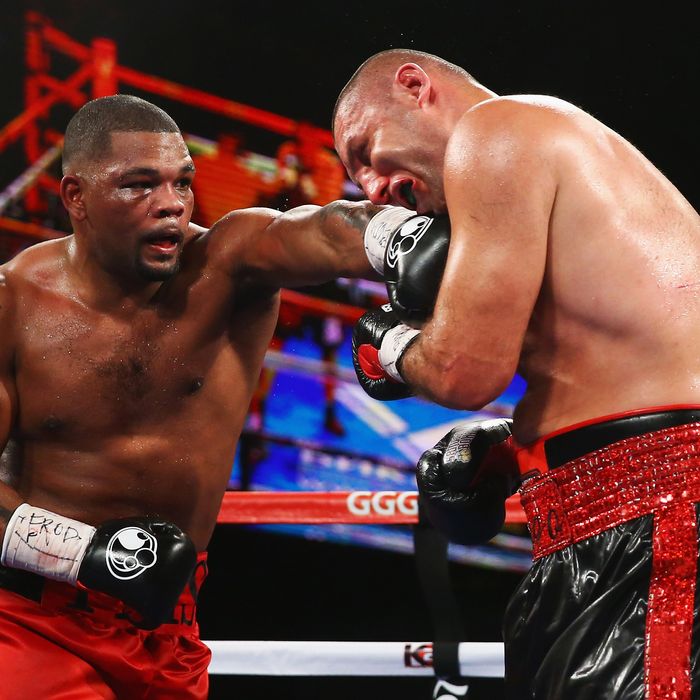 Mike Perez punches Magomed Abdusalamov during their Heavyweight fight at The Theater at Madison Square Garden on November 2, 2013 in New York City.